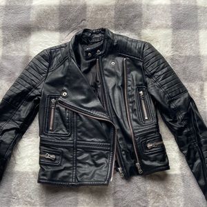 Black vegan leather jacket. Has tearing in the lining that is easily fixed.